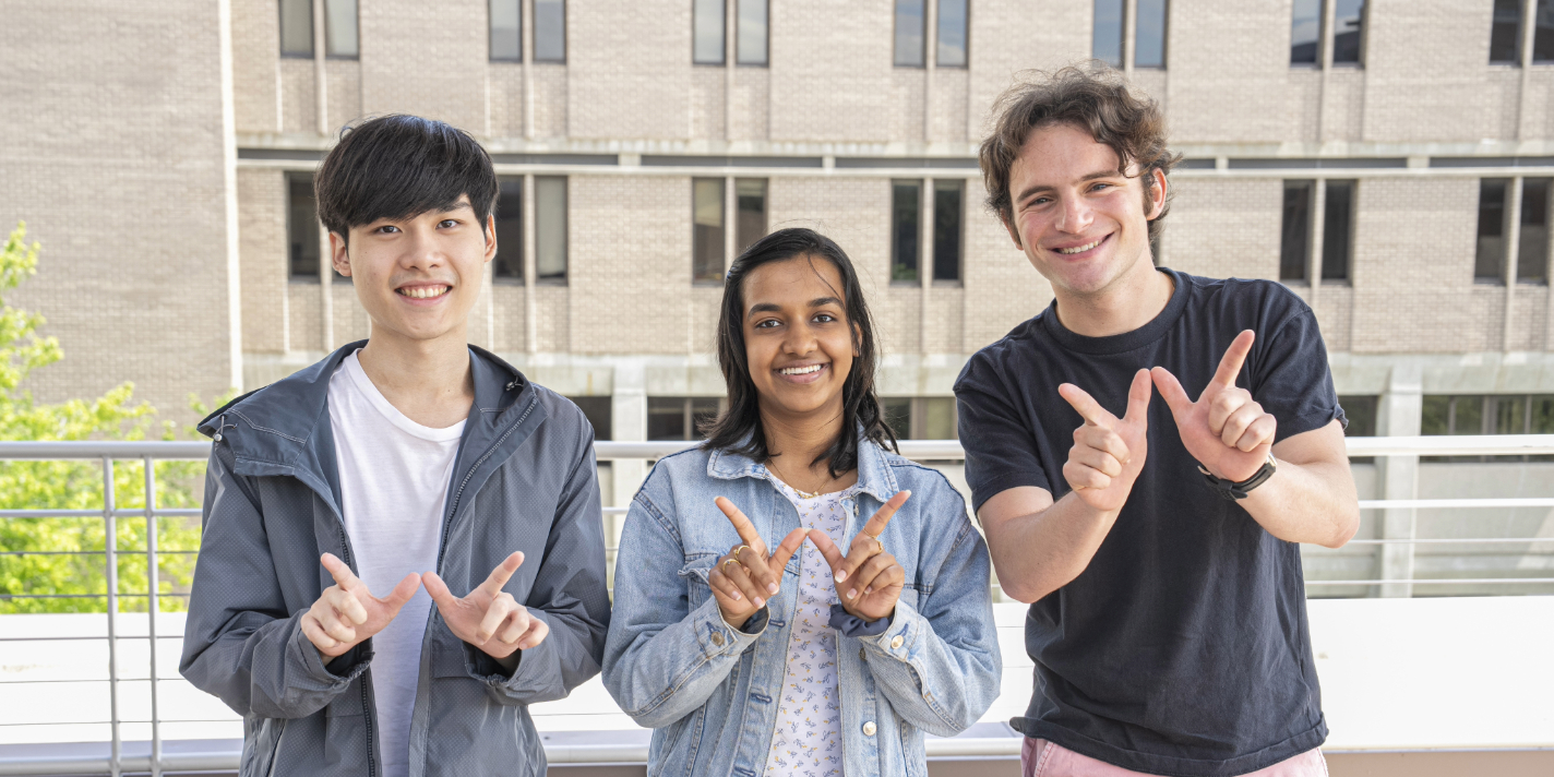 Students making a W with their hands