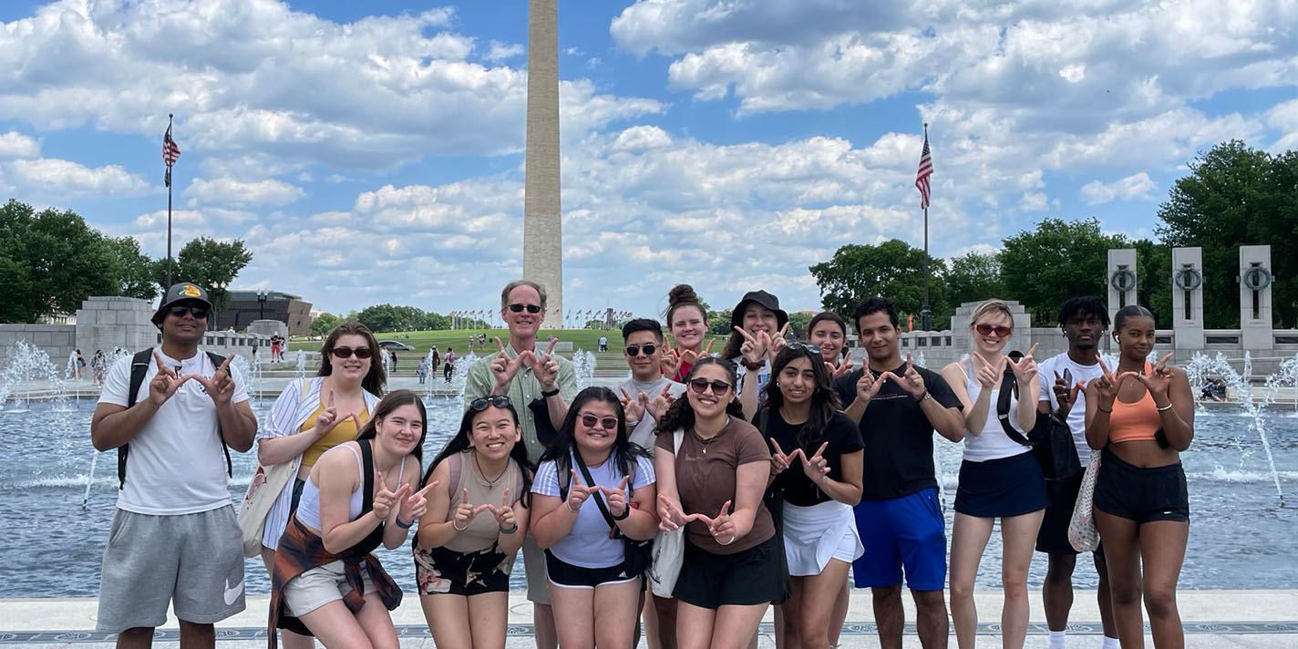 Students pose for a picture at the Washington Memorial in DC