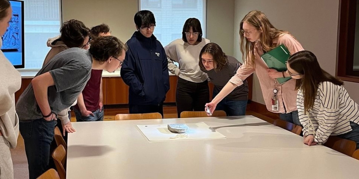 Students examining an artifact