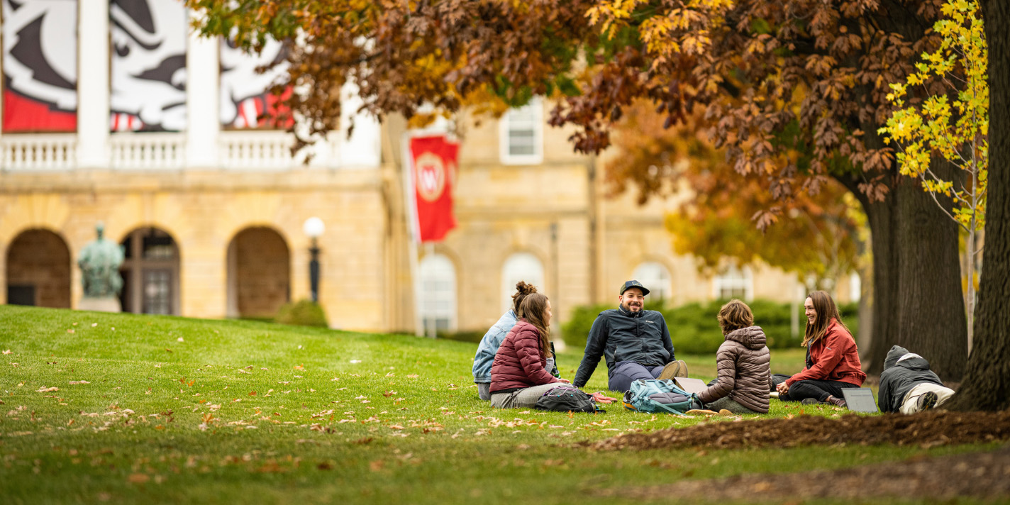 Students enjoying the turn of the season on Bascom Hill