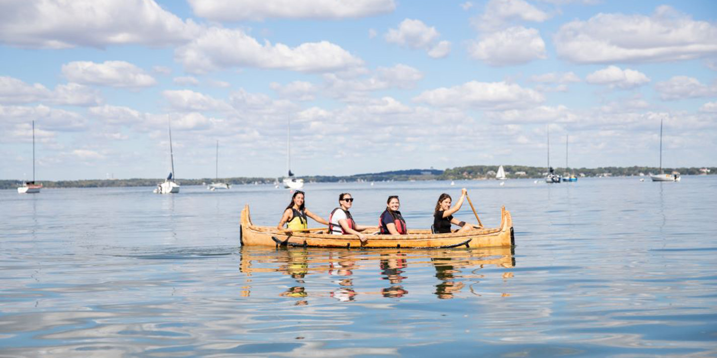People seen on a canoe on Lake Mendota