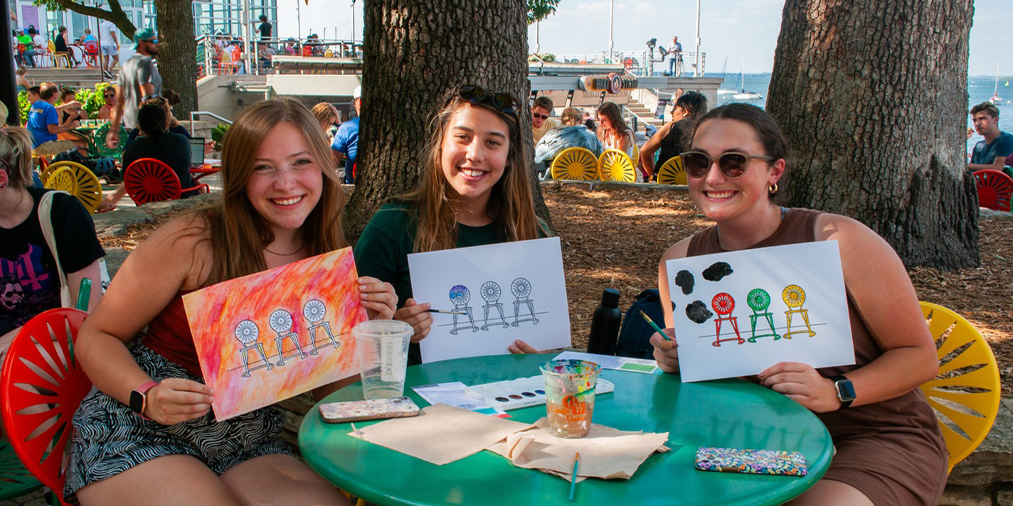 Students showing their art work on the Memorial Union Terrace