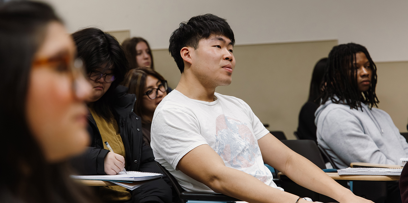 Students attentively listen during a lecture