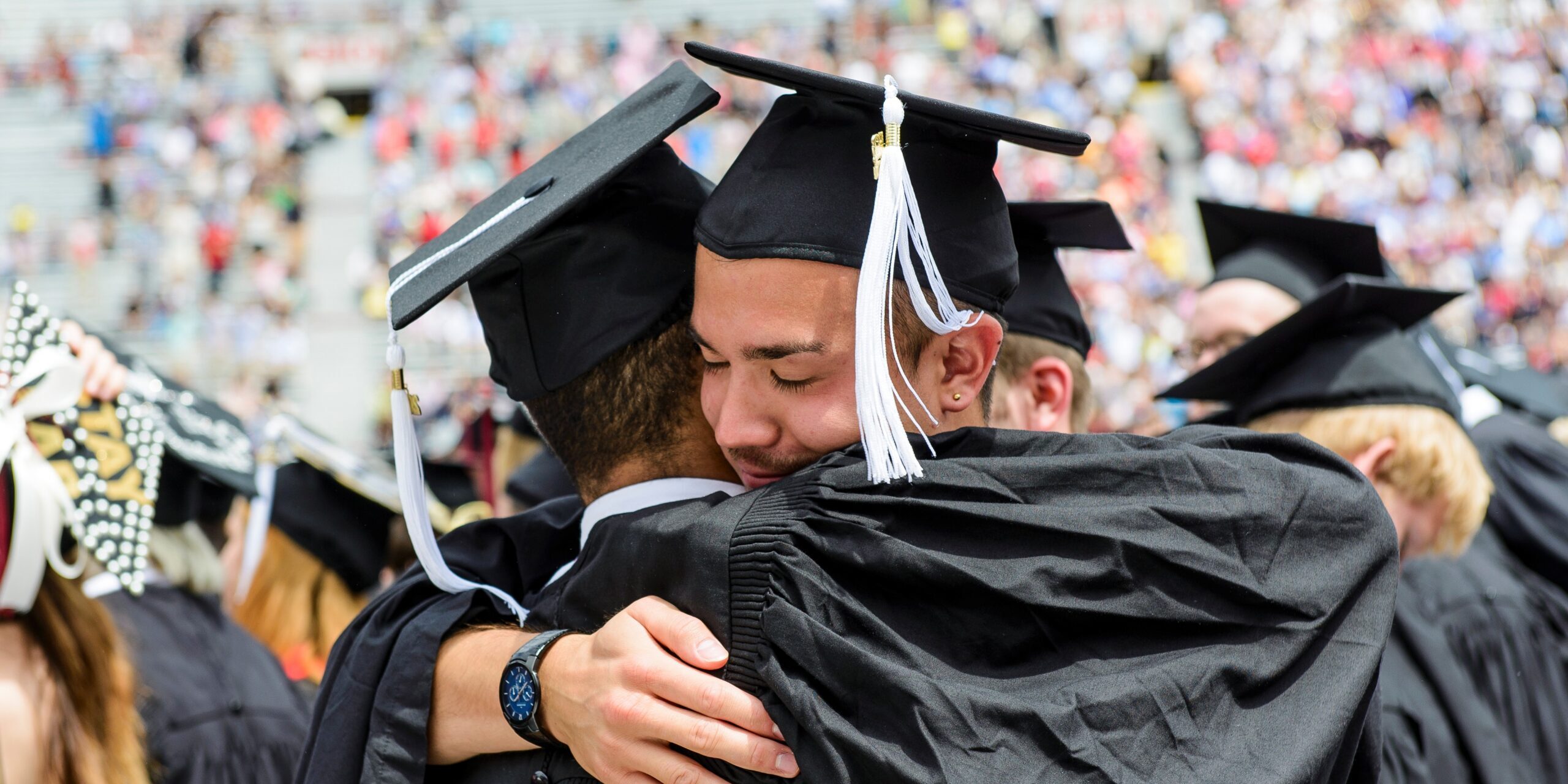 Students hugging at Commencement