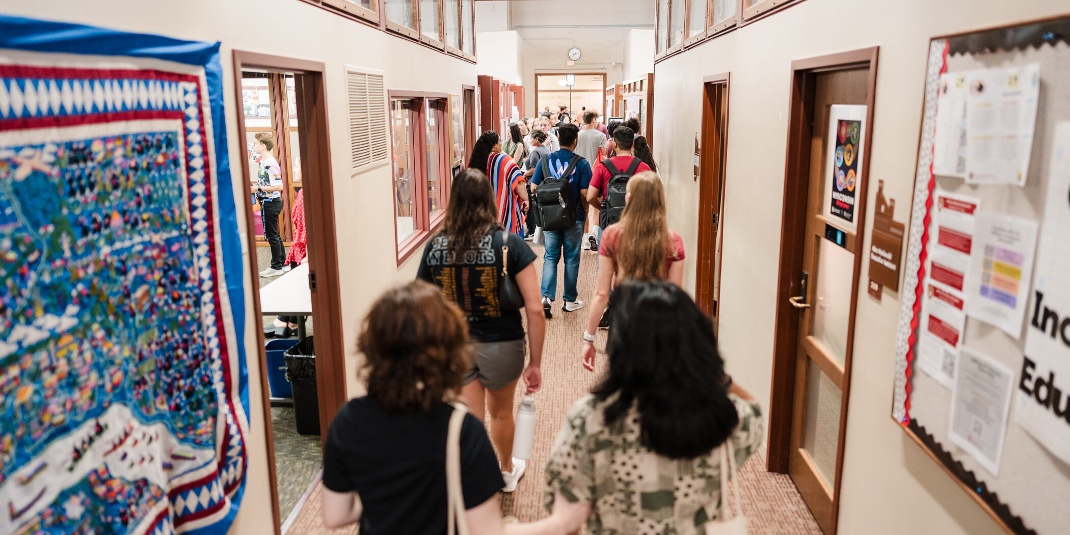 Students walking down the hall in the Red Gym